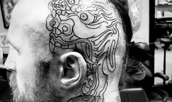 Malakai Black head tattoo