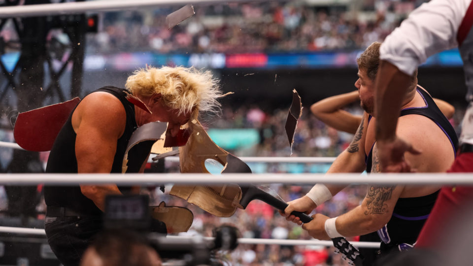 Grado smashes a guitar over Jeff Jarrett's head at AEW All In
